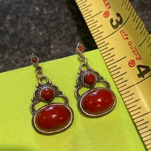 Red stone, silver tone pierced earrings
